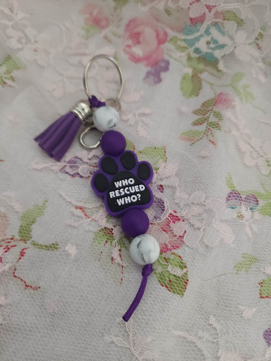 Purple Who rescued who paw beaded keychain